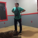 CJ and Mojo the Dog standing proudly on the uncarpetted floor before the wooden planks were laid. CJ and Mojo the Dog standing proudly on the uncarpetted floor