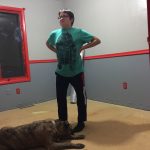 CJ and Mojo the Dog standing proudly on the uncarpetted floor before the wooden planks were laid. CJ and Mojo the Dog standing proudly on the uncarpetted floor