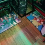 Star Trek floormats and gaming PC Two Star Trek floormats under the desk: one a painting of TOS crew in a rock band and the other depicting the Animated Series crew.