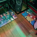 Star Trek floormats and gaming PC Two Star Trek floormats under the desk: one a painting of TOS crew in a rock band and the other depicting the Animated Series crew.